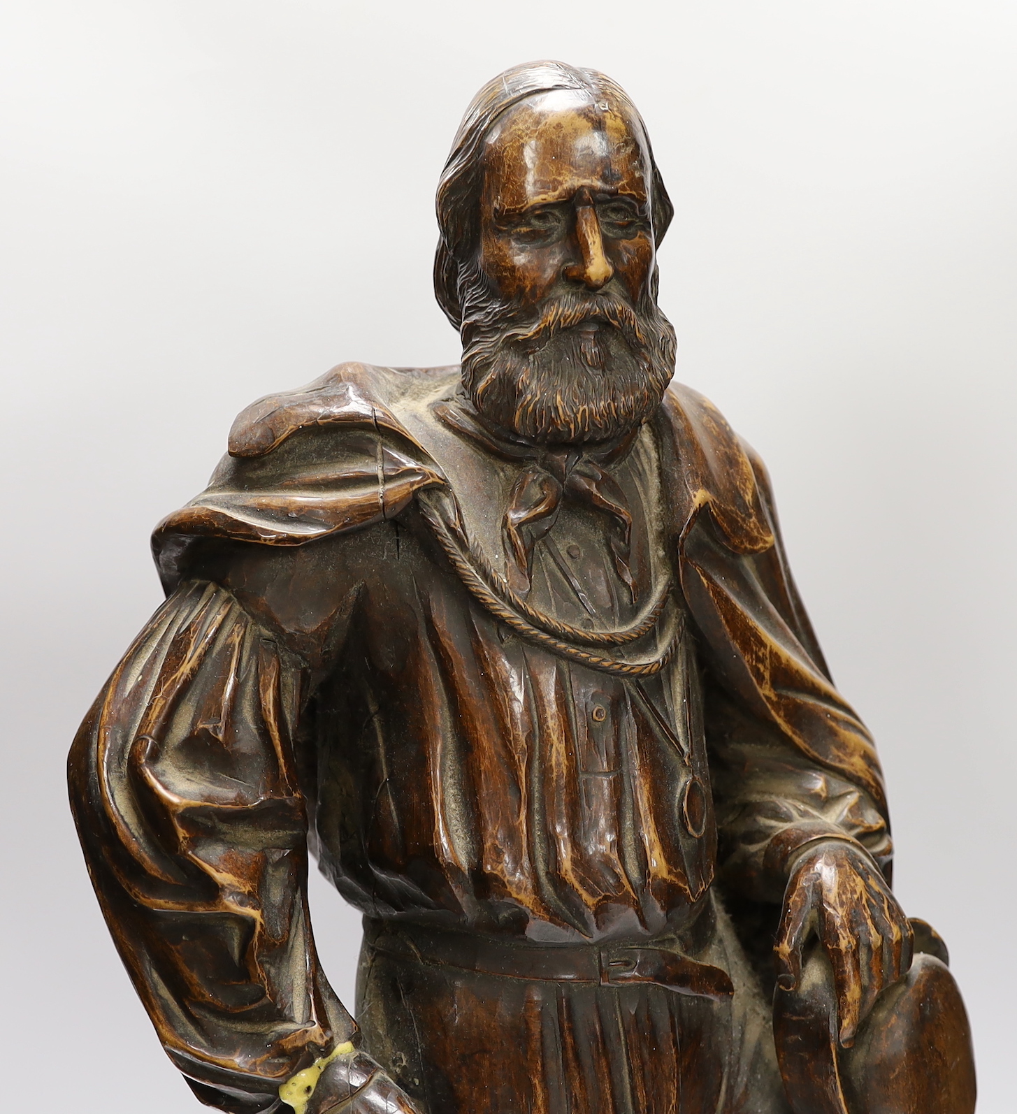 A carved wood figure of Garibaldi, signed to G. Robinson, Manchester, 61cm